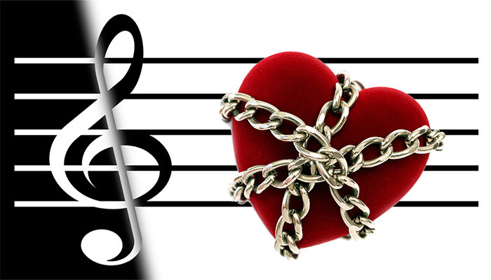 black and white music staff with red heart in chains