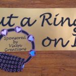Sign reading "Put a Ring on It -- Sponsored by Vixen Creations"